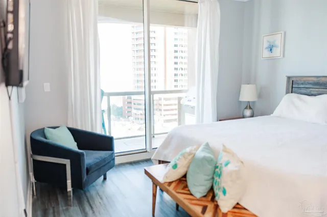 a bedroom with a bed and window