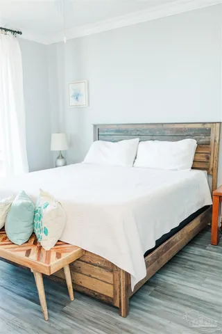 a living room with a couch and a potted plant