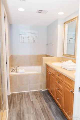 a bathroom with a bathtub and shower