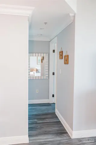 a room with a sink and wooden floor