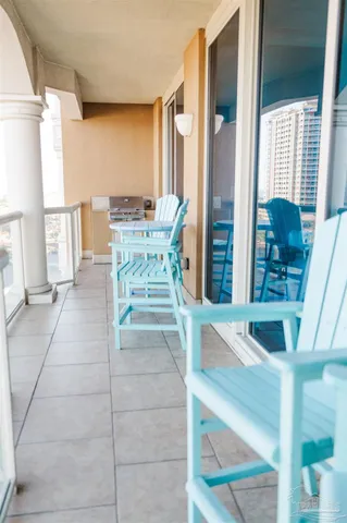 a view of a dining room with furniture and a large window