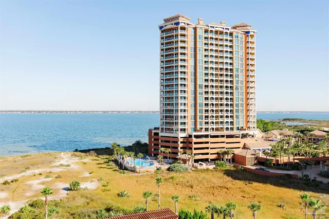a view of a swimming pool with a lounge chairs