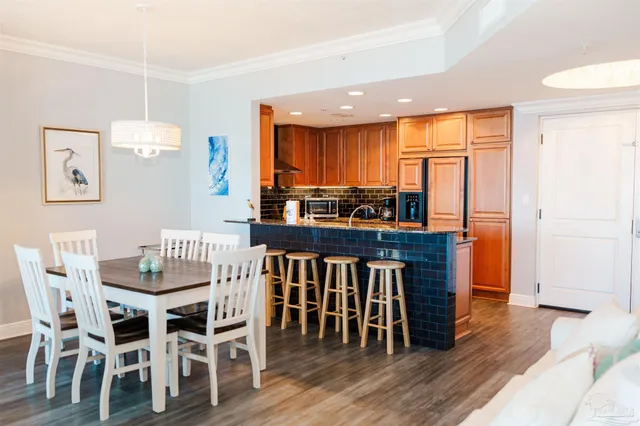 a dining table with chairs and wooden floor