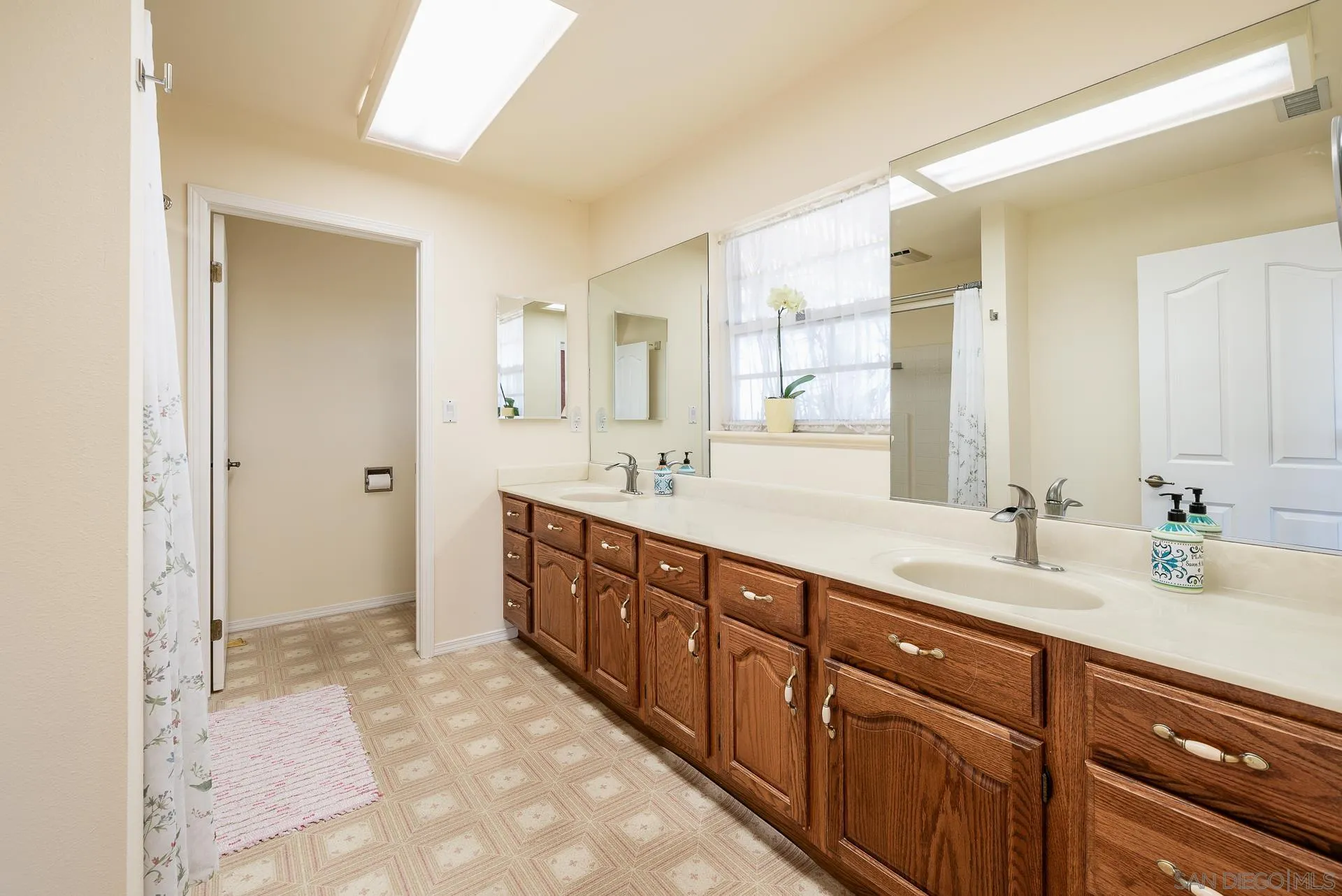 4241 Via El Dorado Fallbrook, CA 92028 - Photo 25 of 64 a spacious bathroom with double sink and a mirror