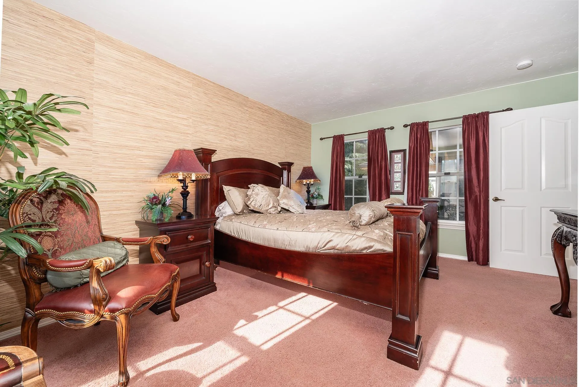 4241 Via El Dorado Fallbrook, CA 92028 - Photo 29 of 64 a bedroom with a bed and large windows