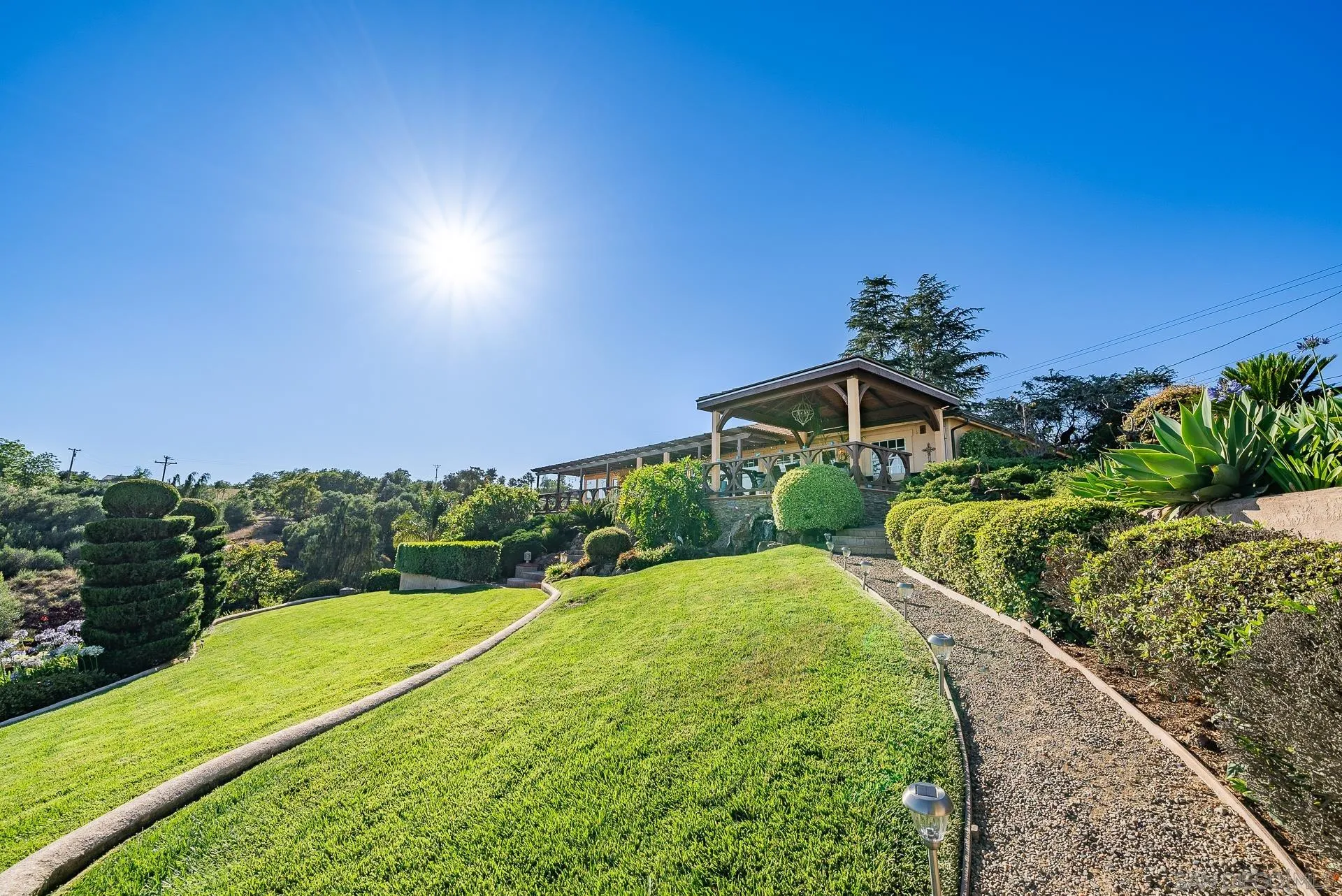 4241 Via El Dorado Fallbrook, CA 92028 - Photo 47 of 64 a view of a garden with a building in the background