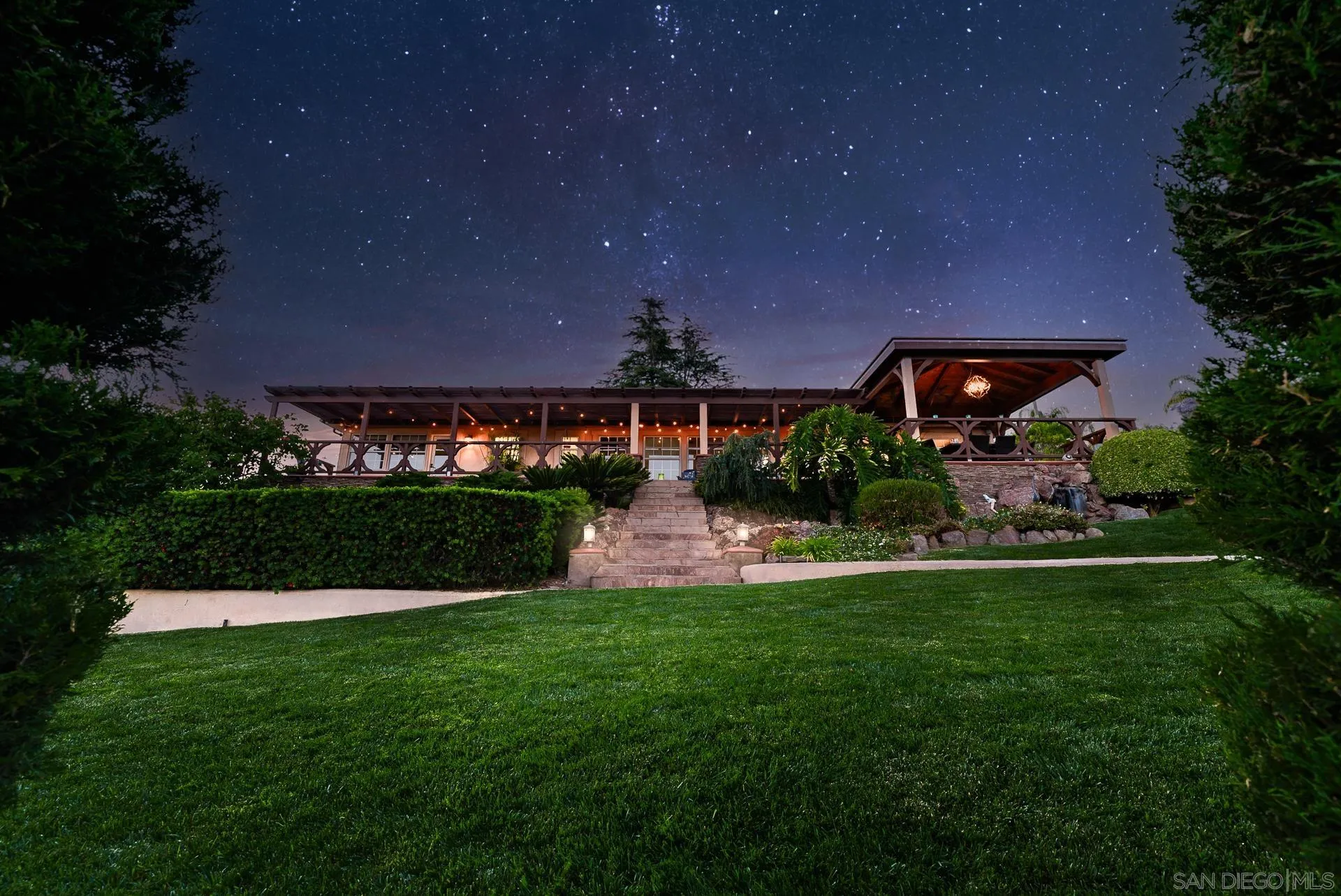 4241 Via El Dorado Fallbrook, CA 92028 - Photo 5 of 64 a front view of a house with a yard and outdoor seating