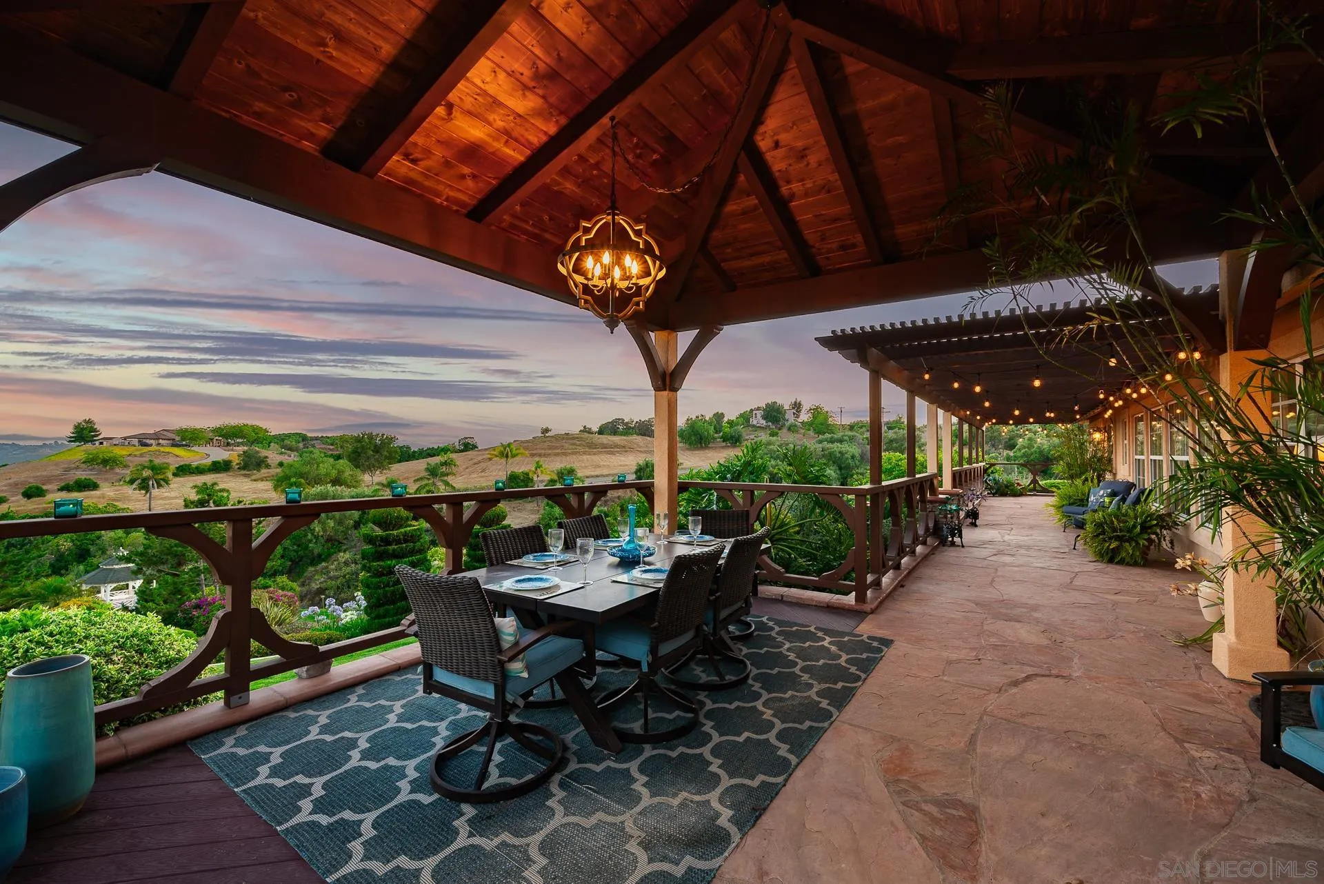 4241 Via El Dorado Fallbrook, CA 92028 - Photo 6 of 64 a view of a patio with table and chairs potted plants with wooden floor