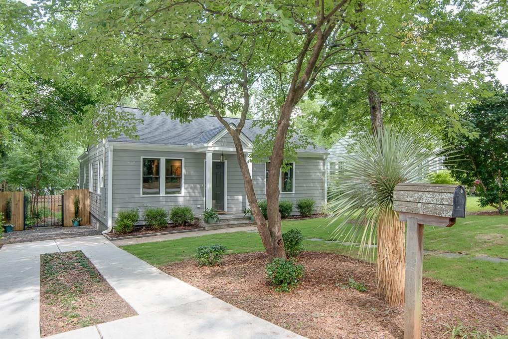 763 Brown Place Decatur, GA 30030 - Photo 1 of 1 a front view of a house with a yard and trees