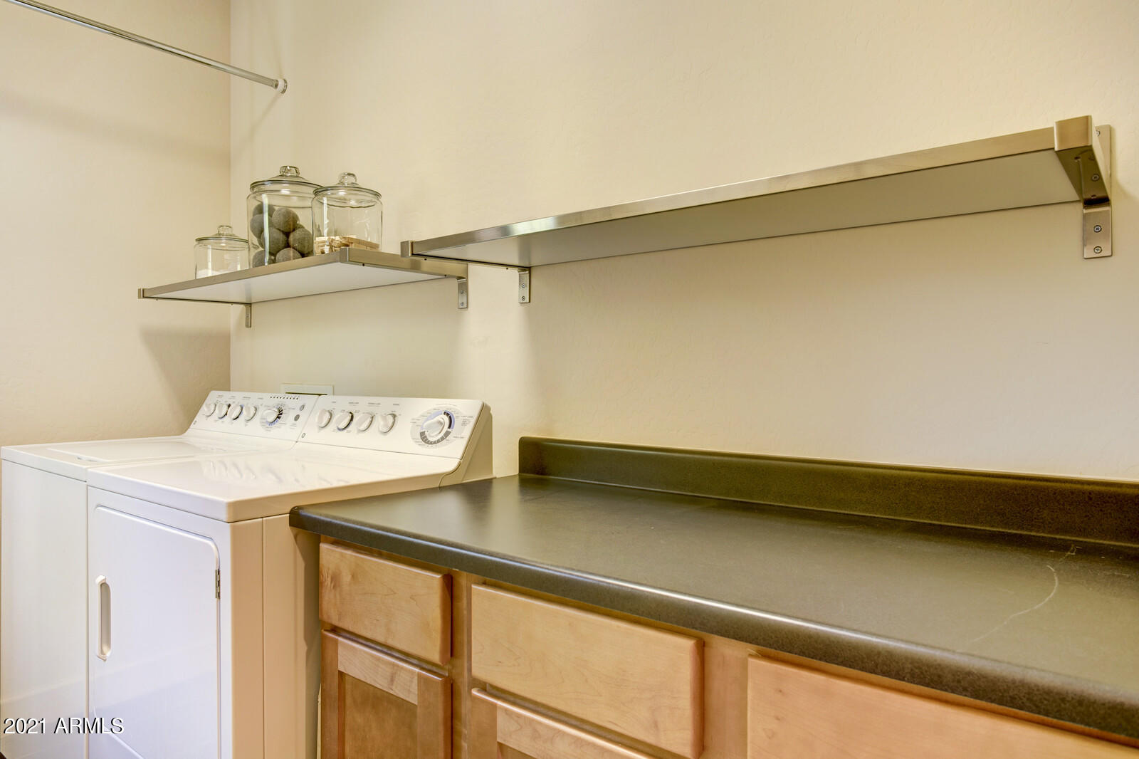 3935 East Rough Rider Road, Unit 1360 Phoenix, AZ 85050 - Photo 29 of 47 Laundry with extra storage