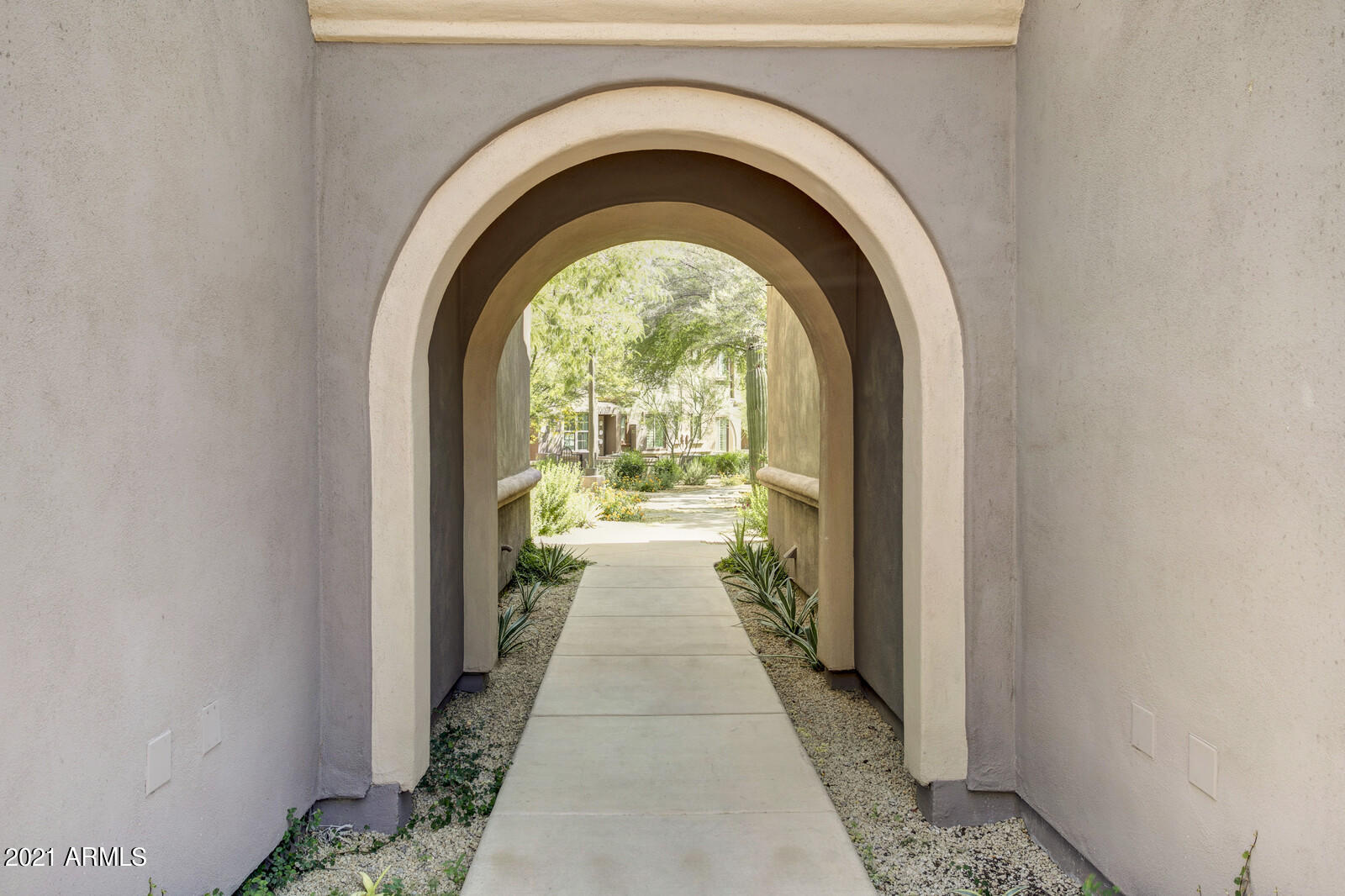 3935 East Rough Rider Road, Unit 1360 Phoenix, AZ 85050 - Photo 7 of 47 Tunnel to paved auto court
