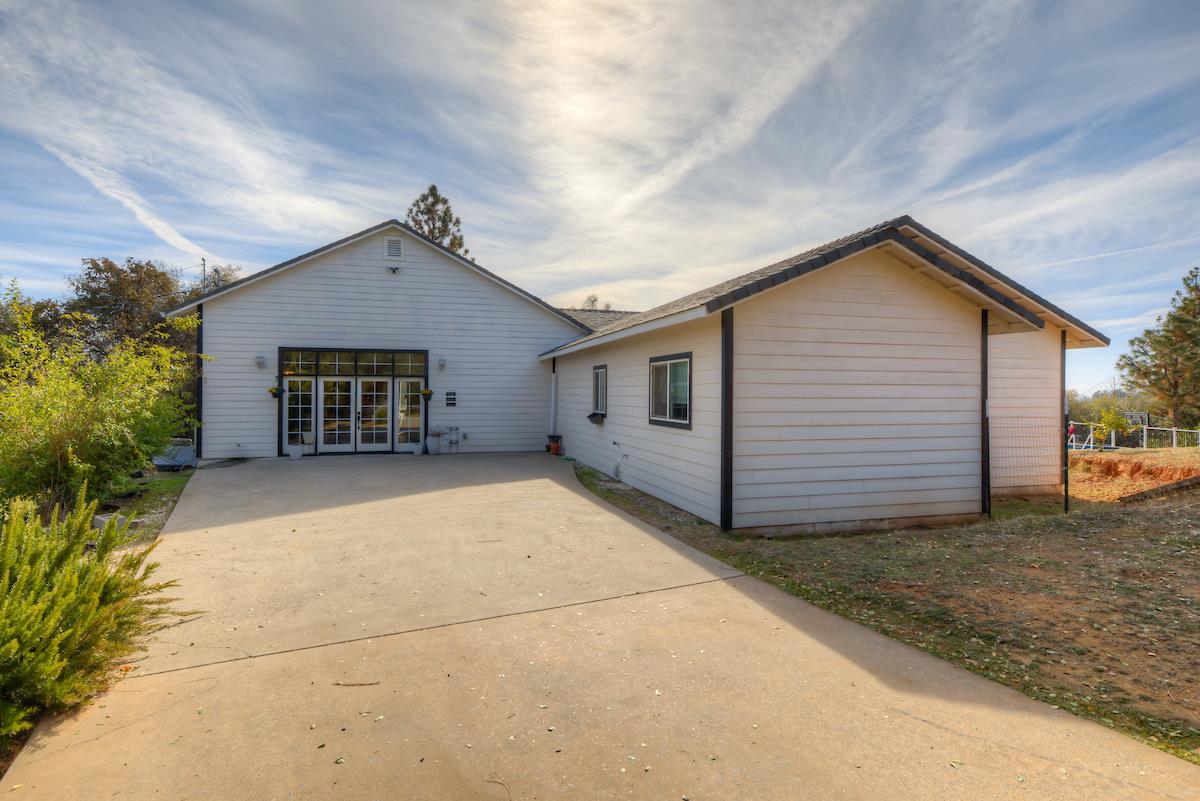 83 Northfork Road Berry Creek, CA 95916 - Photo 23 of 56 a view of house with garage and yard