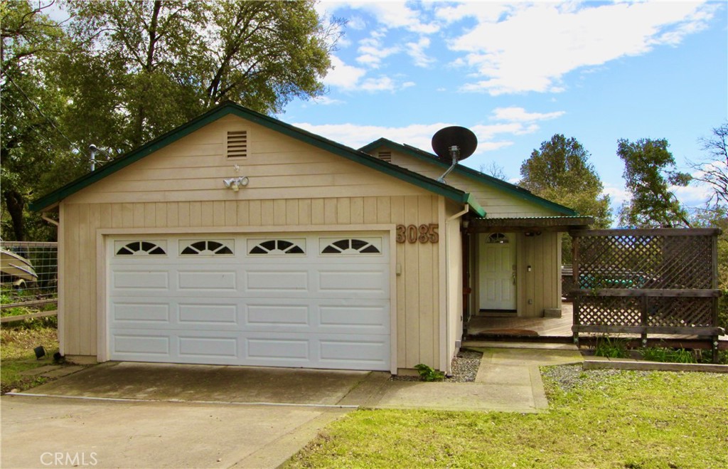 3085 Gardner Road Nice, CA 95464 - Photo 1 of 20 a view of a white house with large windows