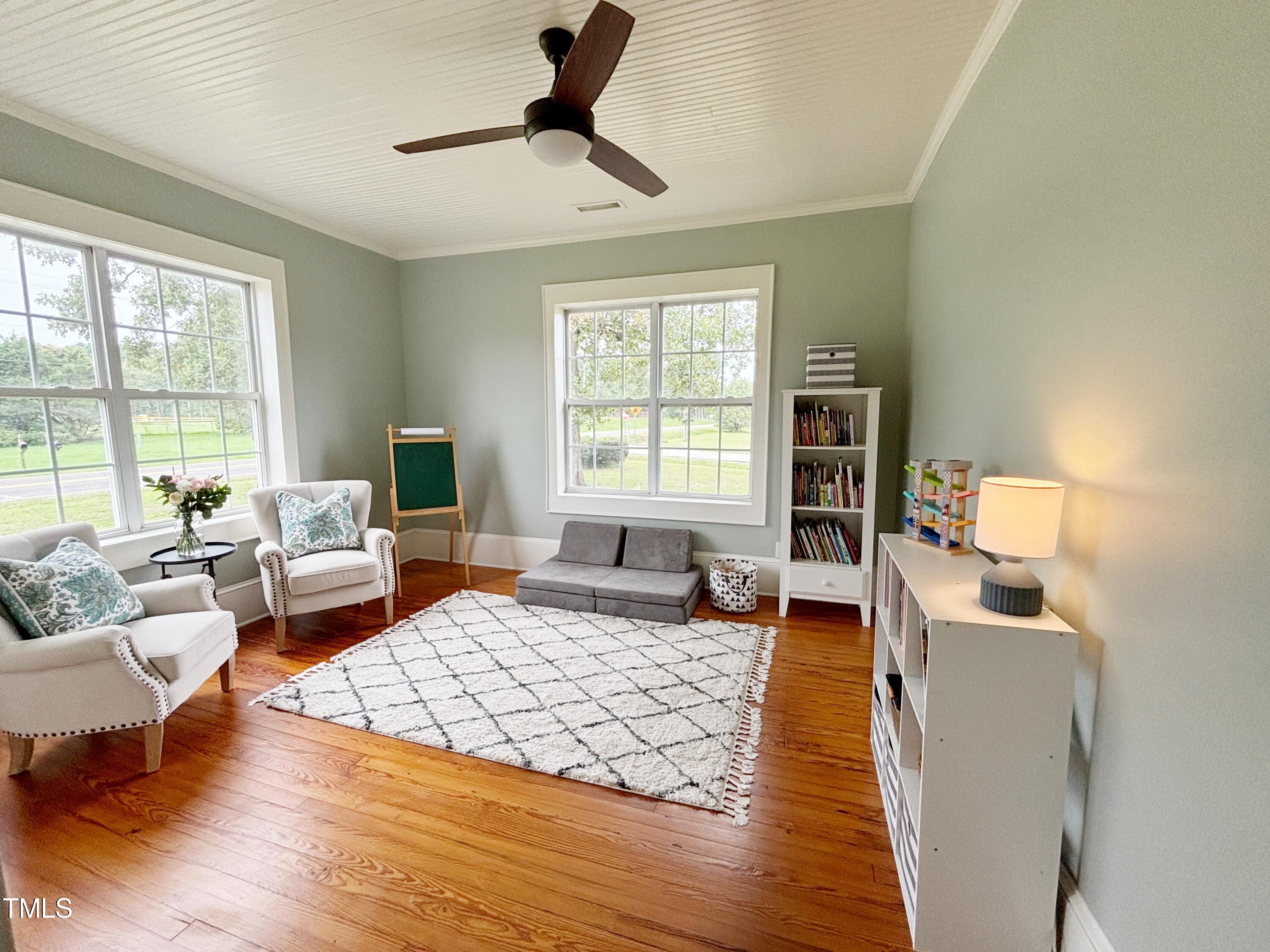 6033 Robertson Pond Road Wendell, NC 27591 - Photo 26 of 47 Bedroom or Office Space with hardwood floors, ceiling fan and crown molding.