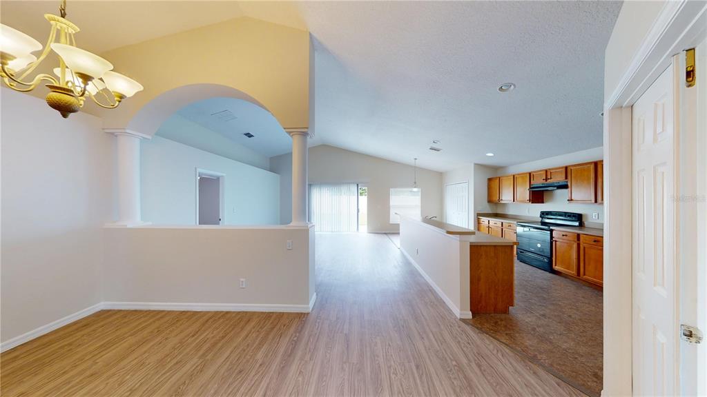 3209 Murray Hill Loop Kissimmee, FL 34758 - Photo 11 of 23 a view of kitchen with furniture and wooden floor