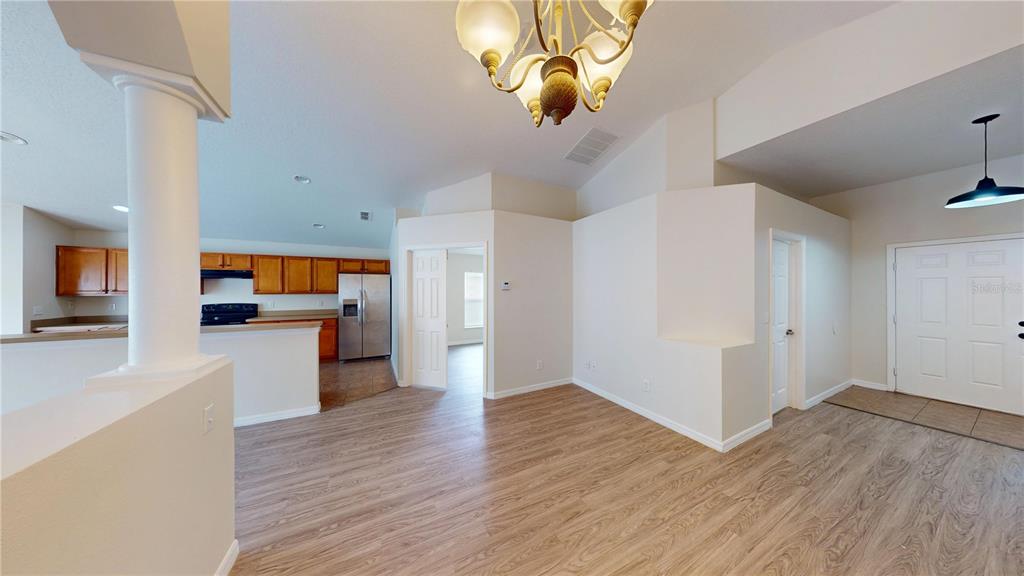 3209 Murray Hill Loop Kissimmee, FL 34758 - Photo 12 of 23 a view of a kitchen with a sink a refrigerator and window