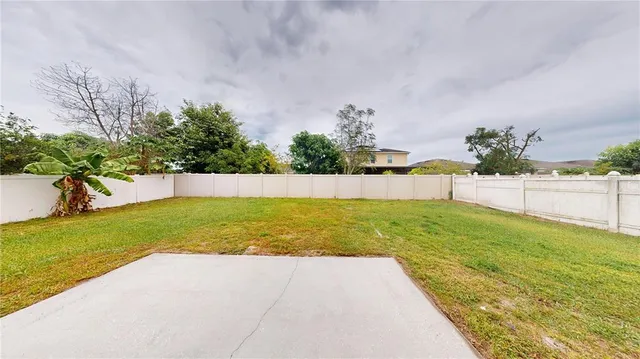 a view of swimming pool with a yard
