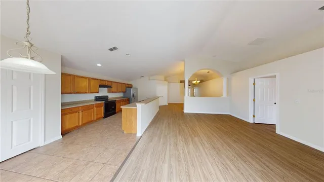a view of a kitchen with a sink and cabinets