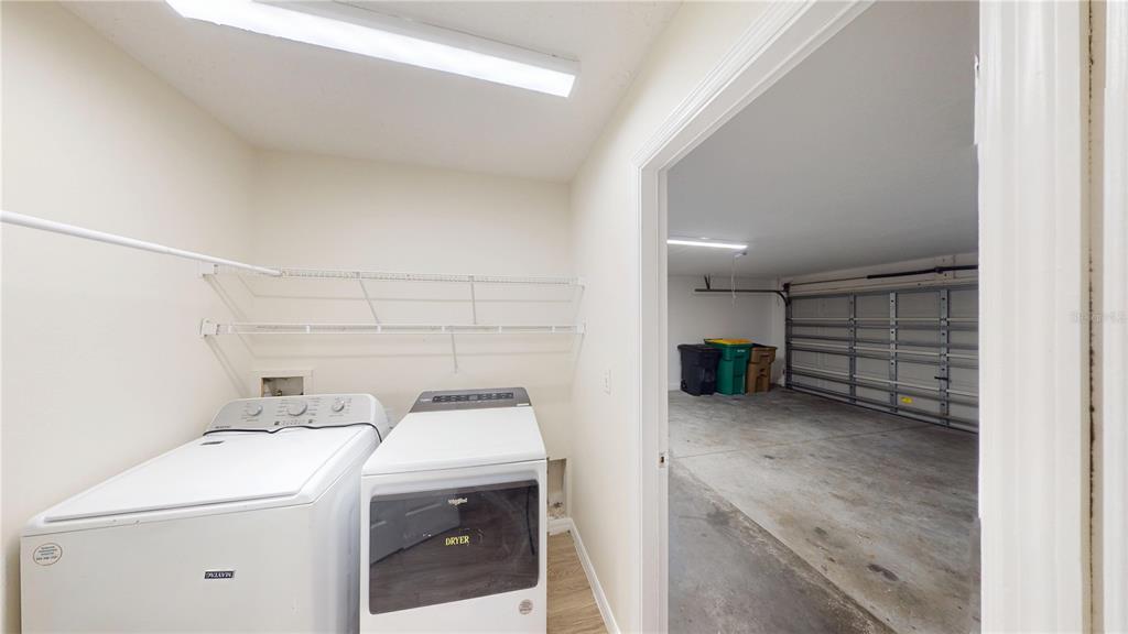 3209 Murray Hill Loop Kissimmee, FL 34758 - Photo 10 of 23 a view of storage and utility room with washer and dryer