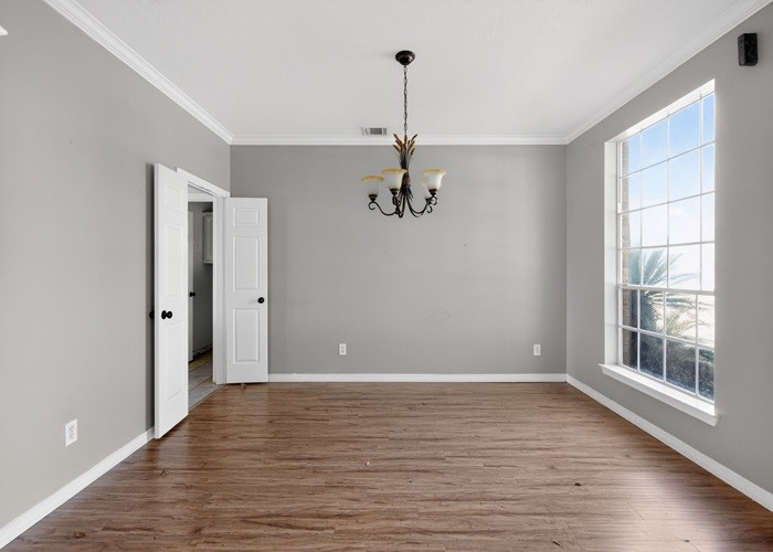 406 Spring Lakes Haven Spring, TX 77373 - Photo 12 of 24 a view of a room with wooden floor chandelier and windows