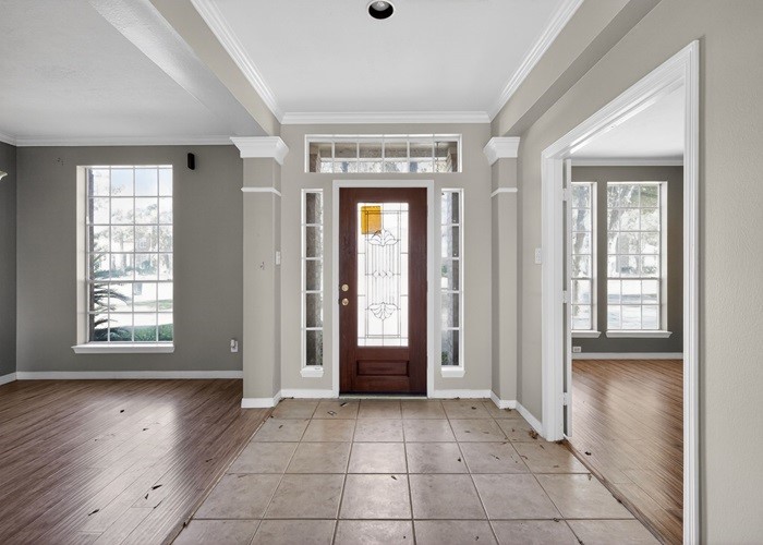 406 Spring Lakes Haven Spring, TX 77373 - Photo 5 of 24 a view of a hallway with wooden floor and a living room