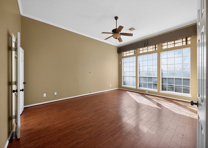 406 Spring Lakes Haven Spring, TX 77373 - Photo 10 of 24 a view of an empty room with a window and wooden floor