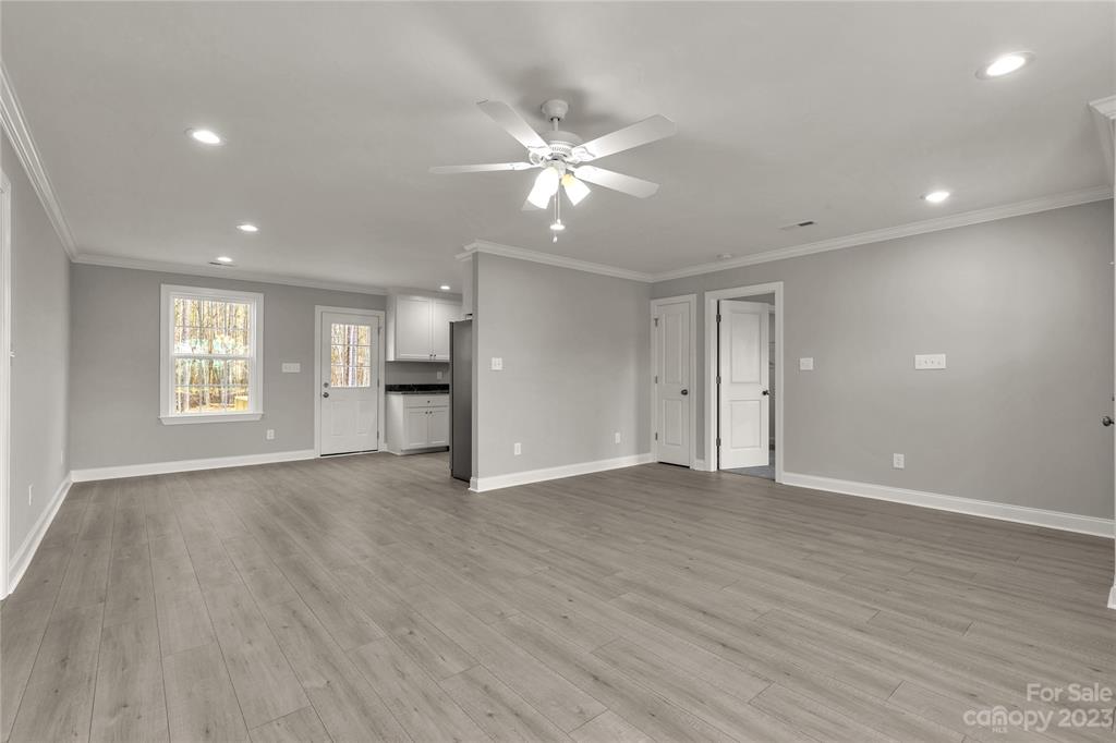 6724 State Rd S-29-555 Kershaw, SC 29067 - Photo 11 of 31 a view of an empty room with a window and wooden floor