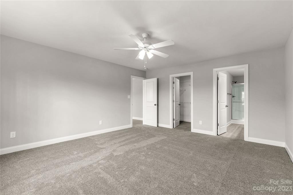 6724 State Rd S-29-555 Kershaw, SC 29067 - Photo 14 of 31 a view of a big room with chandelier fan and windows