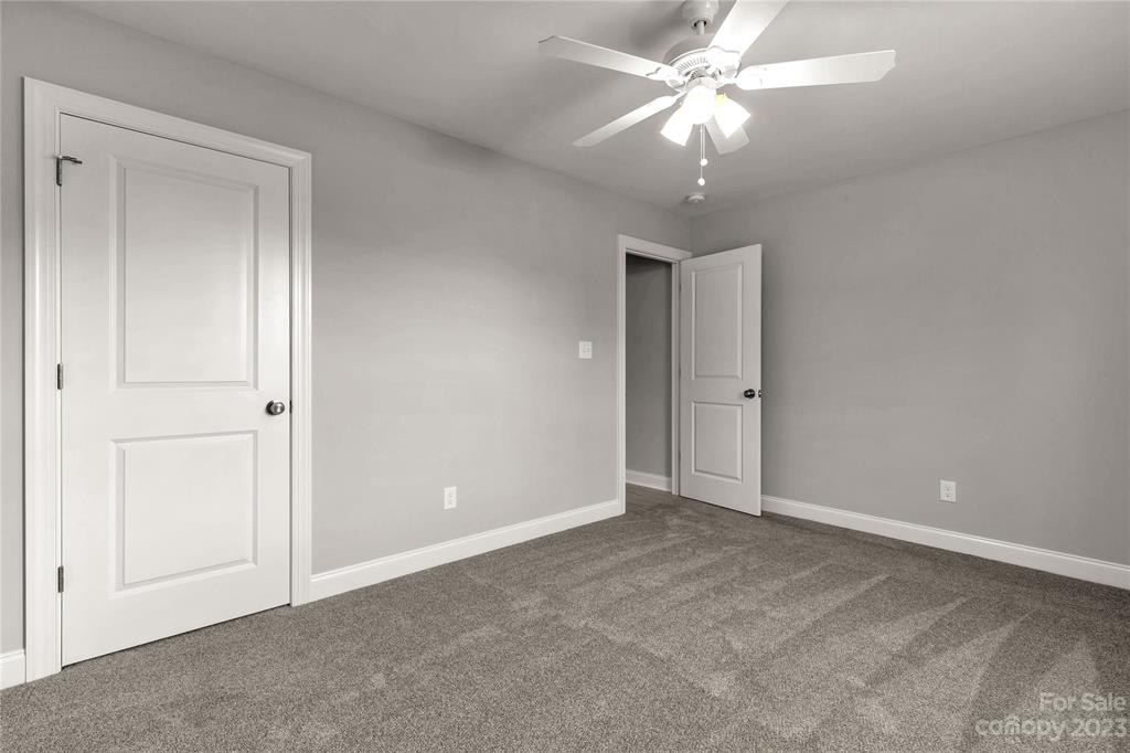 6724 State Rd S-29-555 Kershaw, SC 29067 - Photo 16 of 31 a view of an empty room and chandelier fan