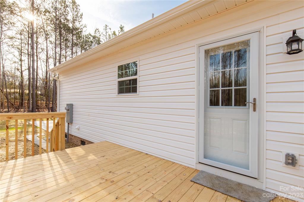 6724 State Rd S-29-555 Kershaw, SC 29067 - Photo 26 of 31 a view of a house with a wooden fence