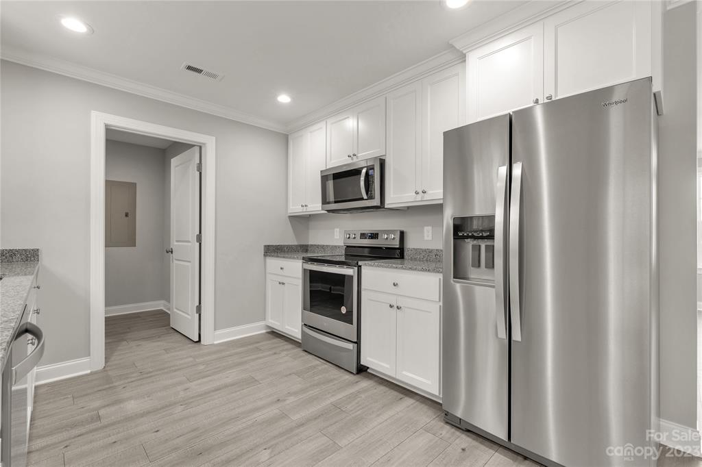 6724 State Rd S-29-555 Kershaw, SC 29067 - Photo 6 of 31 a kitchen with stainless steel appliances a refrigerator sink and microwave