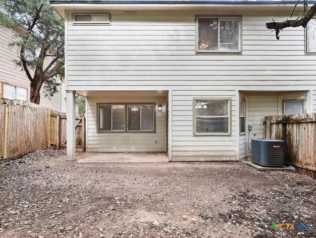 a view of a house with a window and a door