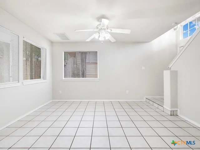 a view of an empty room and window