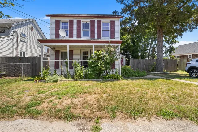 a house view with swimming pool in front of it