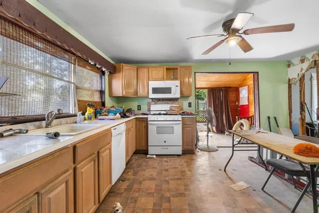 a kitchen with appliances cabinets and a sink