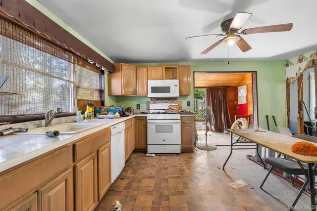 a kitchen with appliances cabinets and a sink