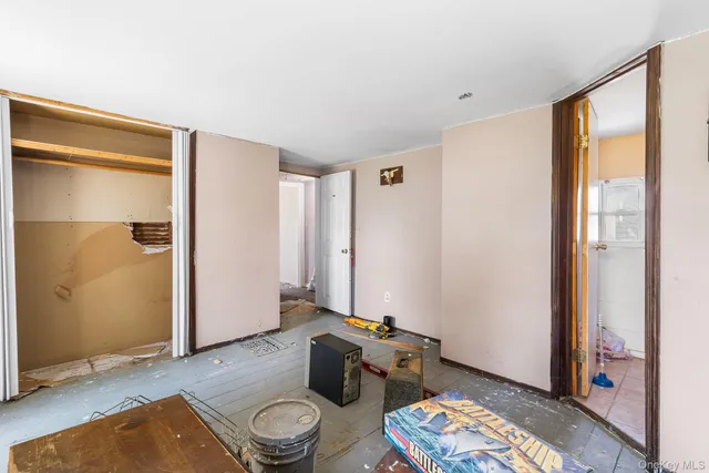 a living room with hard wood floor and a window