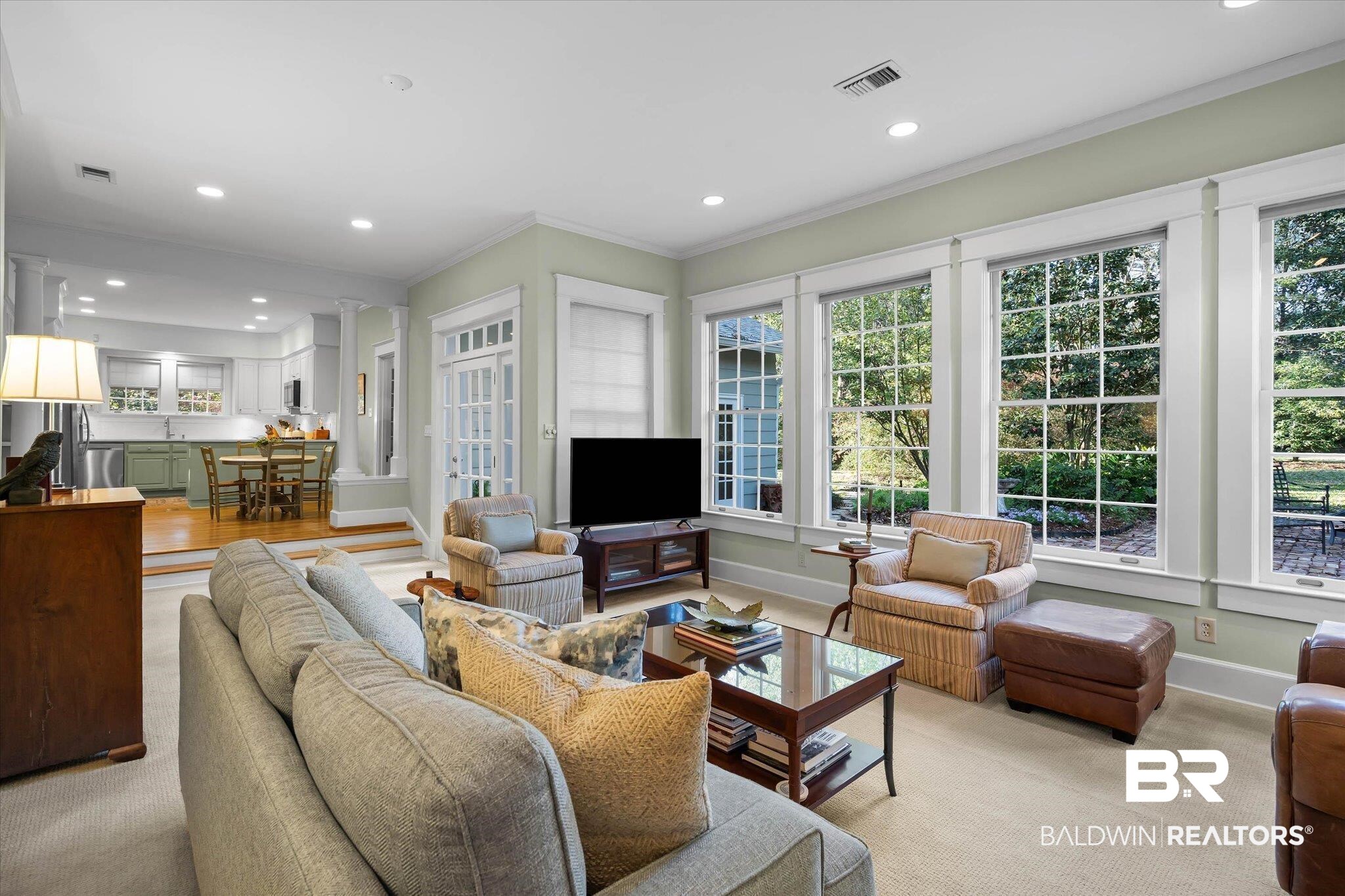 2 Westgate Road Mobile, AL 36608 - Photo 20 of 63 Den with ornamental molding, recessed lighting, light colored carpet, decorative columns, and healthy amount of natural light