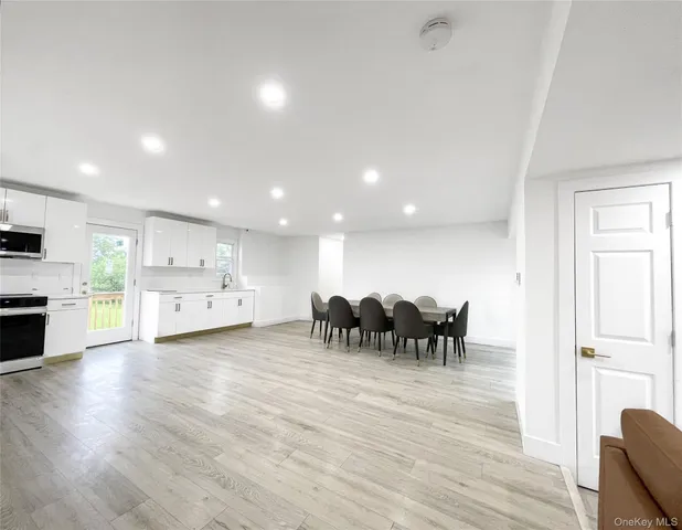 a view of dining room with furniture and wooden floor