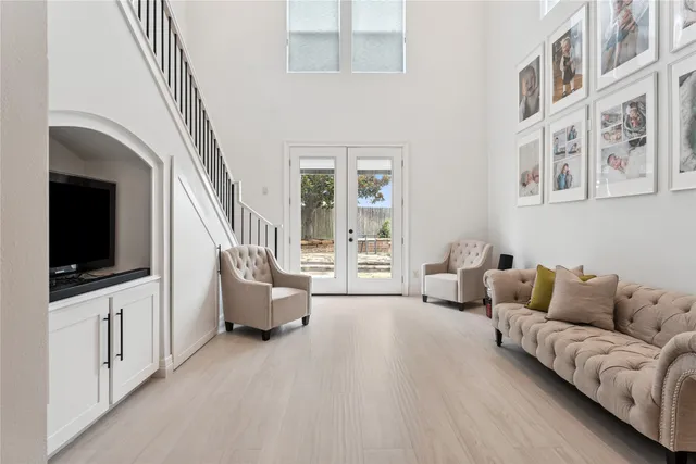 a bathroom with a double vanity sink and a mirror