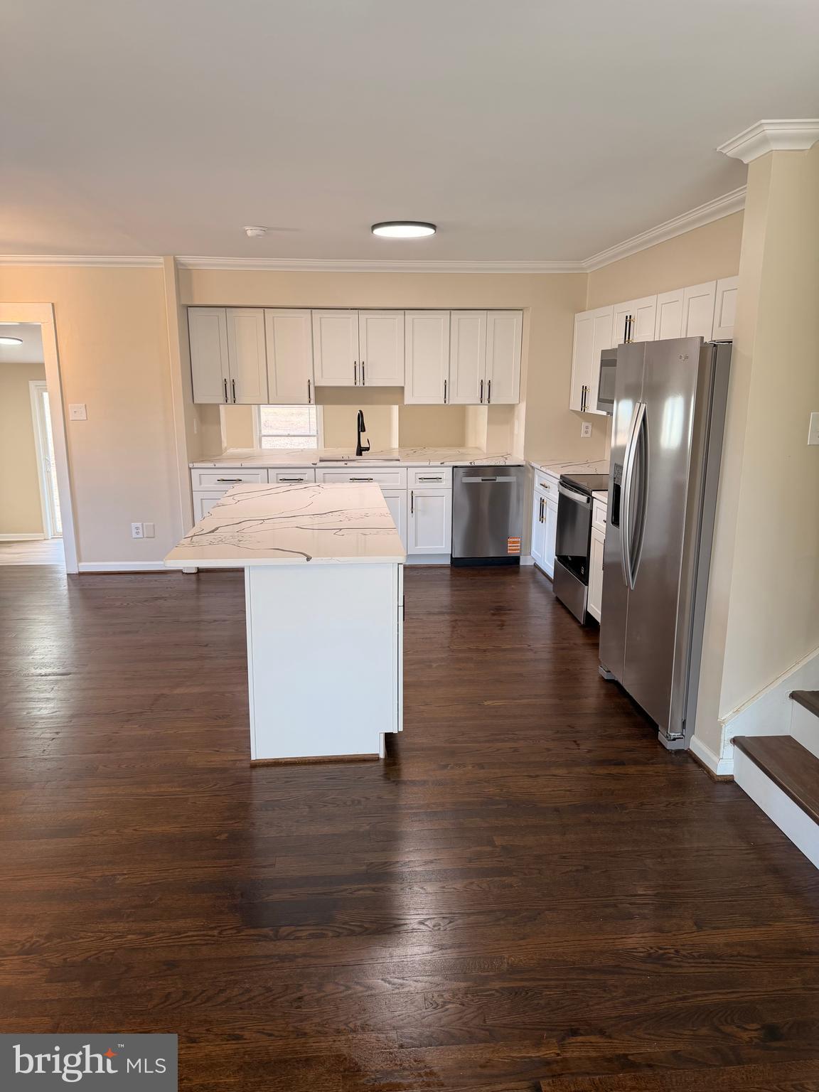 21184 Colton Point Road Avenue, MD 20609 - Photo 3 of 20 a kitchen with stainless steel appliances granite countertop a refrigerator a sink dishwasher a stove and a refrigerator with wooden floor