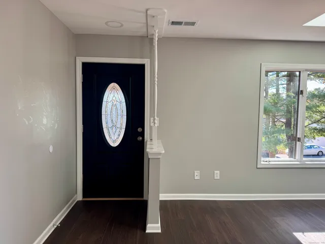 a view of a door with wooden floor