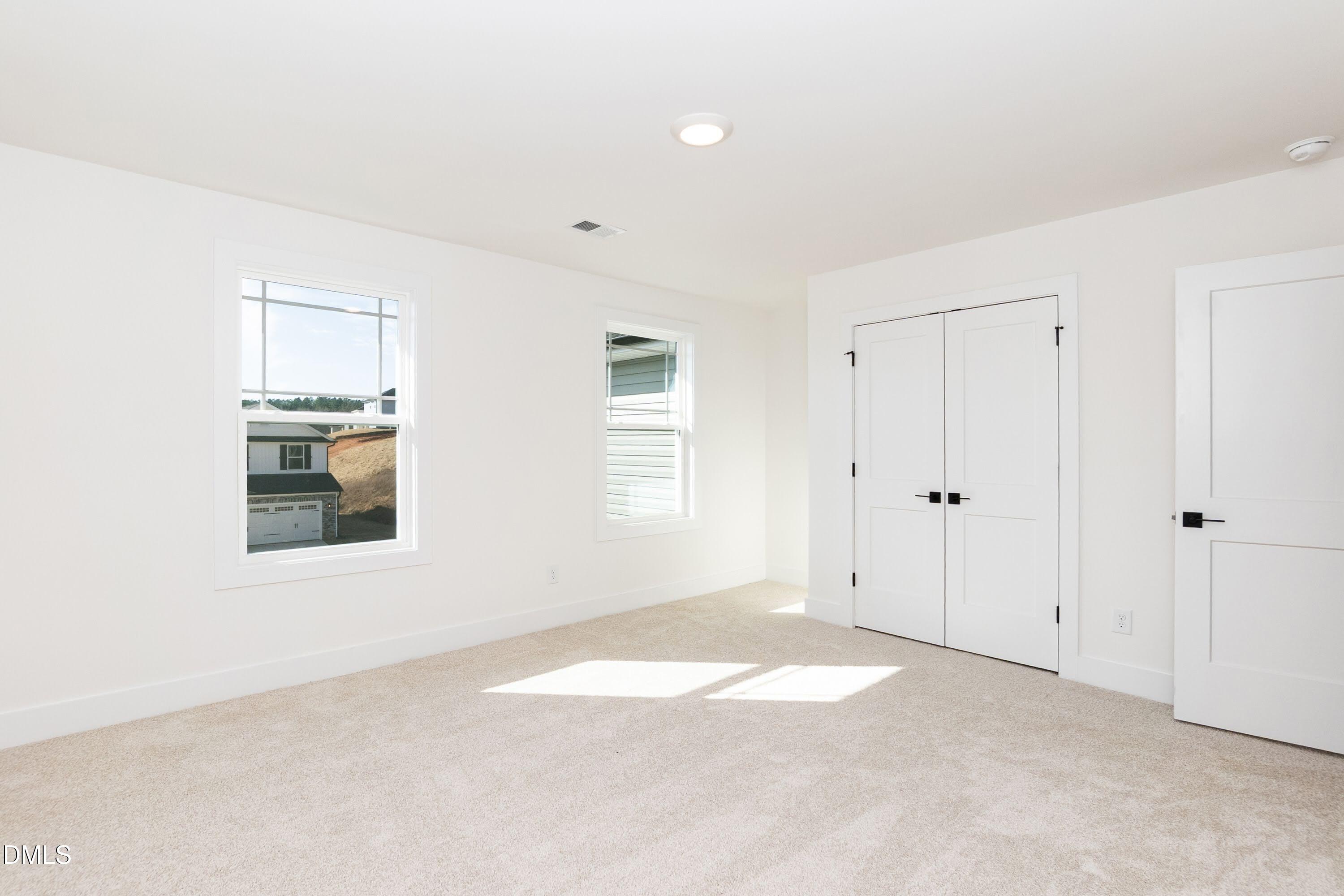 42 Braddock Court Garner, NC 27529 - Photo 29 of 56 a view of an empty room with a window
