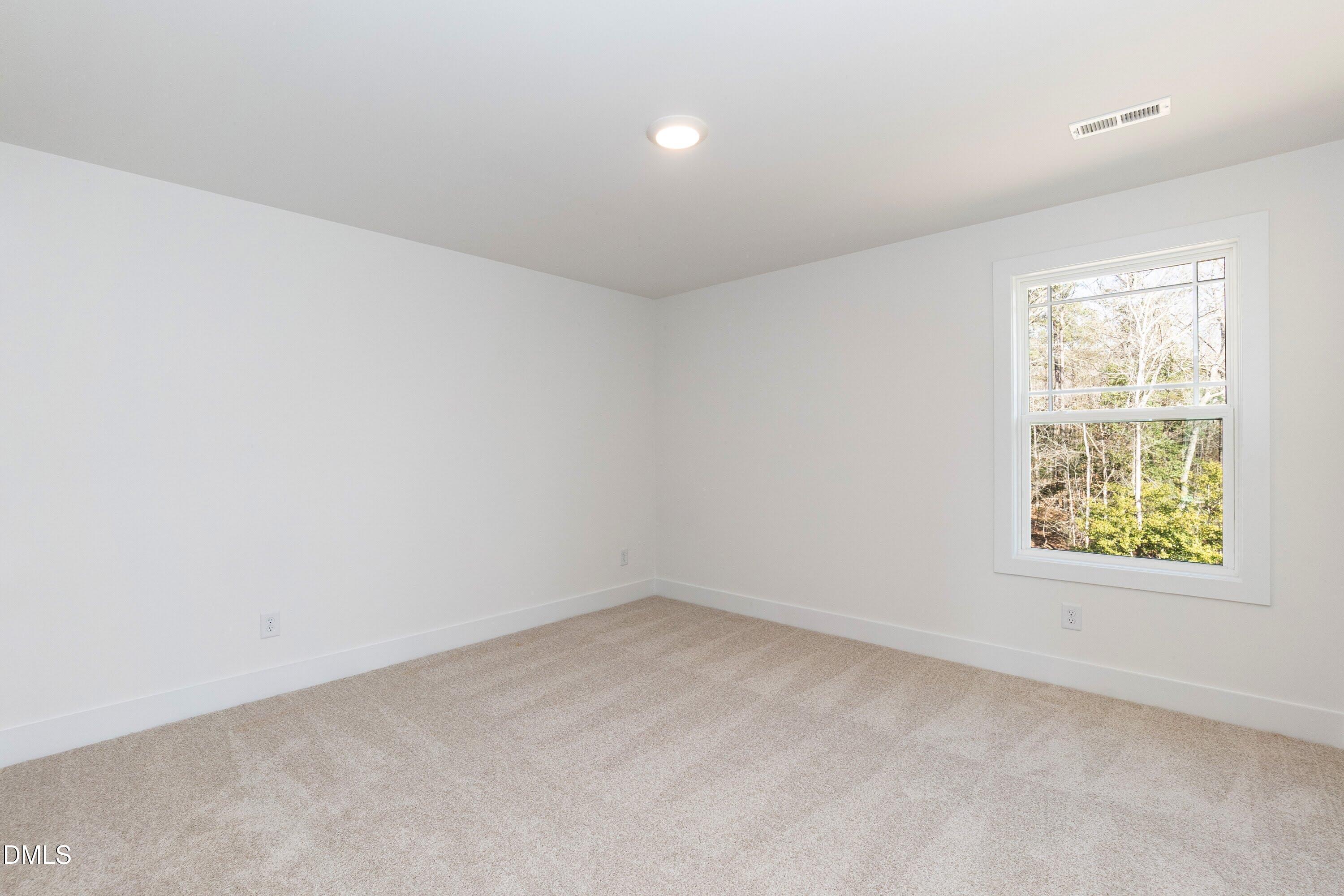 42 Braddock Court Garner, NC 27529 - Photo 33 of 56 an empty room with a window