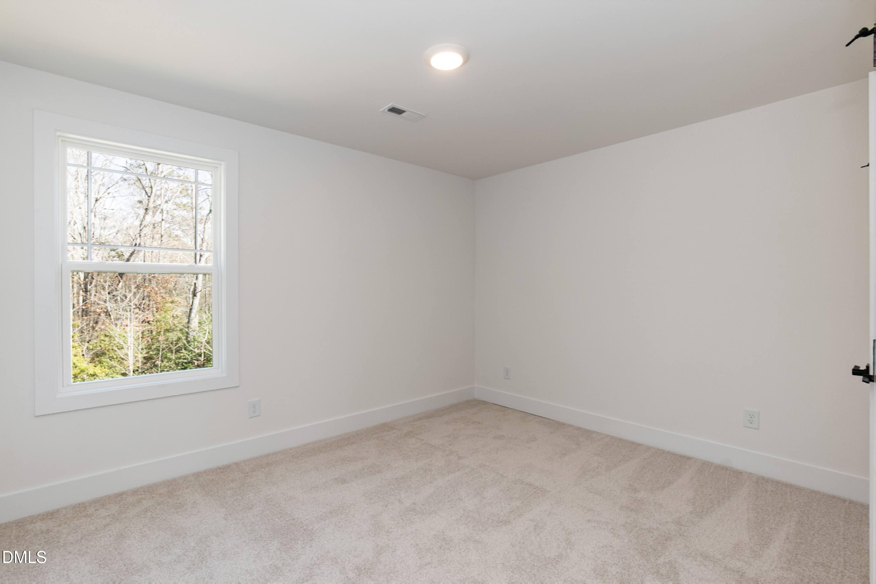 42 Braddock Court Garner, NC 27529 - Photo 34 of 56 an empty room with a window