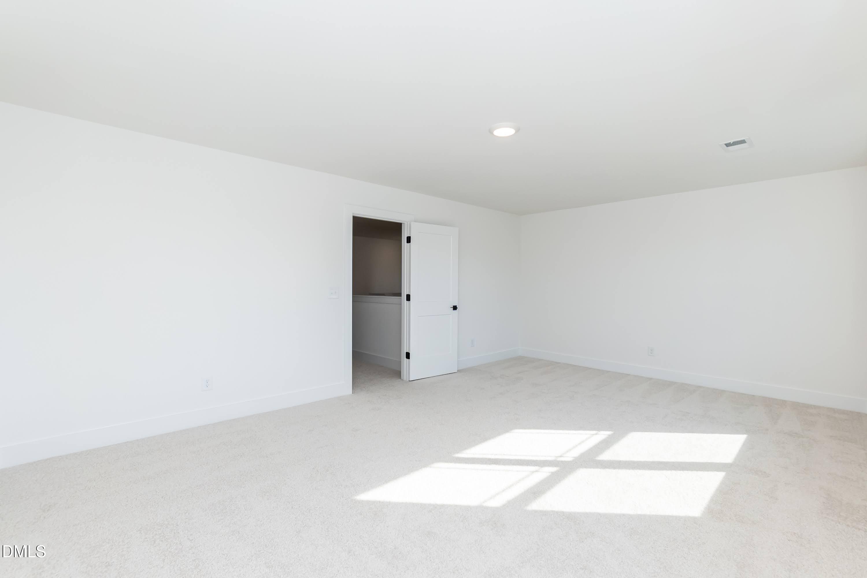 42 Braddock Court Garner, NC 27529 - Photo 36 of 56 an empty room with an entryway
