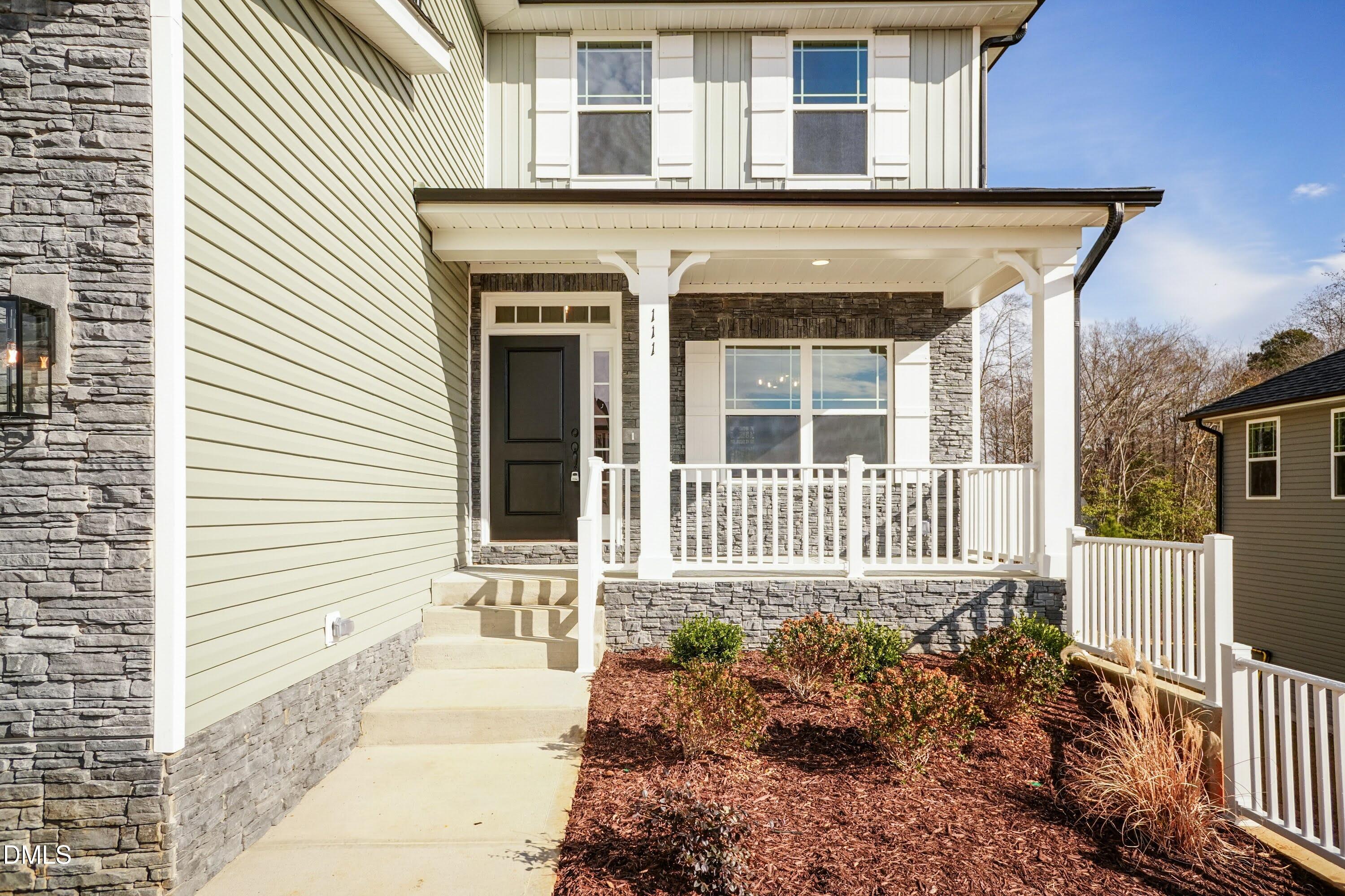 42 Braddock Court Garner, NC 27529 - Photo 5 of 56 a front view of a house with a yard