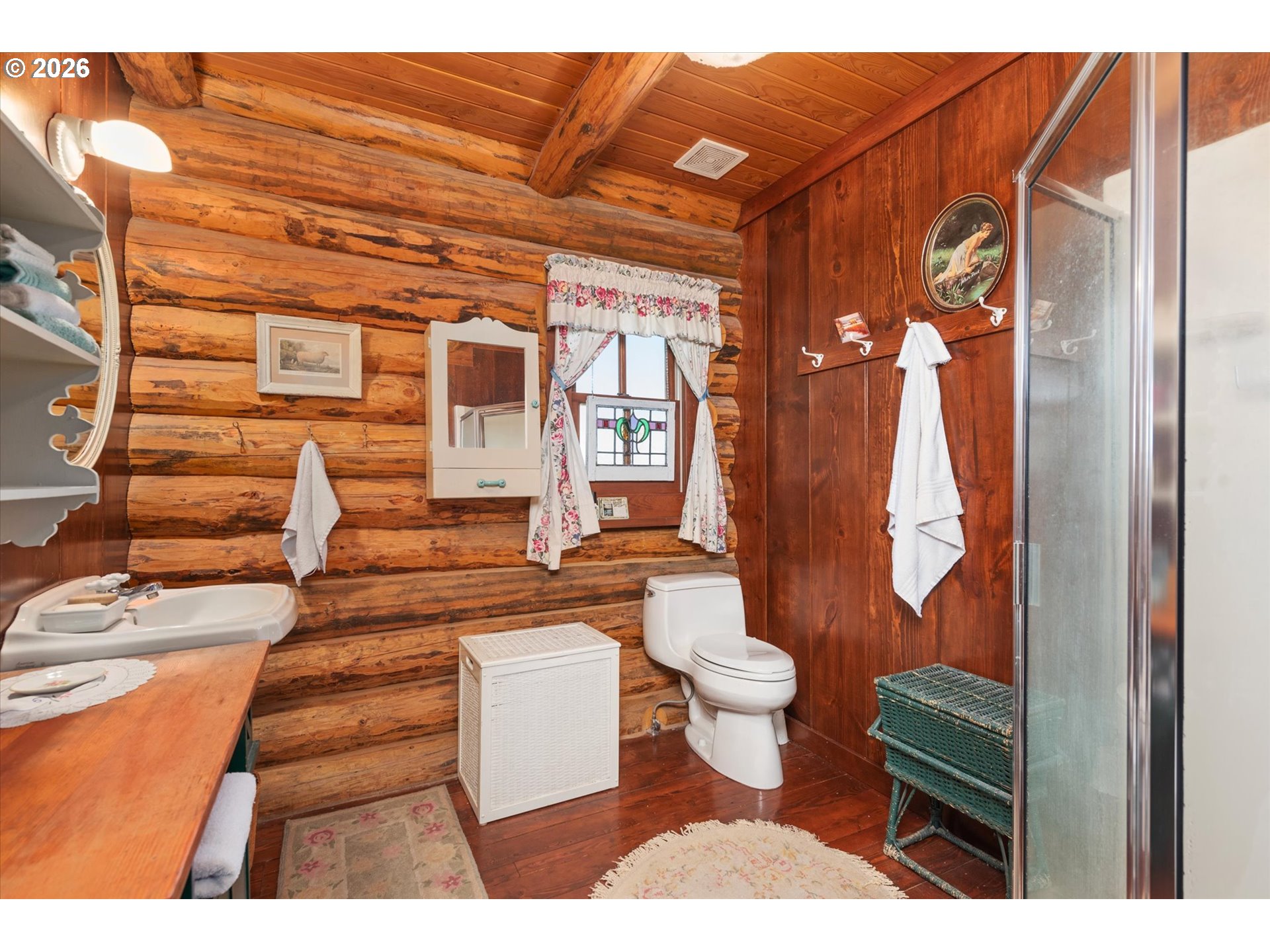 64782 Alder Slope Road Enterprise, OR 97828 - Photo 16 of 48 a bathroom with a toilet sink and mirror