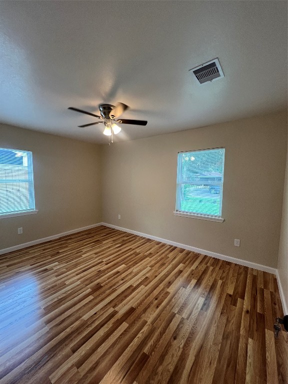 7613 Lady Street Houston, TX 77021 - Photo 11 of 18 a view of a room with wooden floor and fan