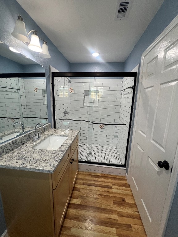 7613 Lady Street Houston, TX 77021 - Photo 13 of 18 a bathroom with a granite countertop sink and a shower